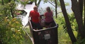 Couple riding tram to lake